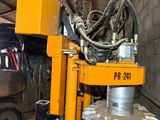a machine that is working on a large piece of machinery