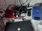 a laptop computer sitting on top of a counter next to other electronics