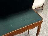 two chairs and a table with a green table top