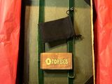 a box that has a wooden key in it