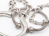 two silver metal rings and a chain on a white background