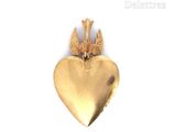 a gold heart with two birds on it on a white background