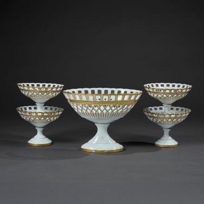 four white and gold footed bowls with gold rims