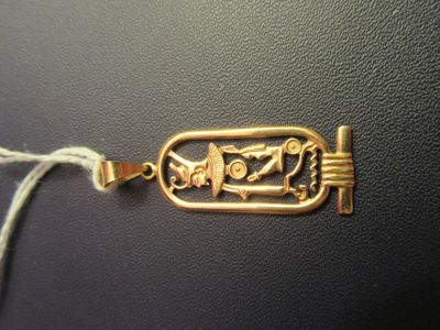 an image of a gold plated bracelet with a design on it