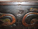 a wooden box with a dragon design on it