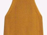 a close up of a yellow knitted tank top on a white background