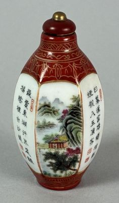 a red vase with asian writing on it