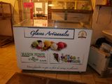a display of ice creams in a glass case