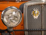 a close up of the front of an orange truck
