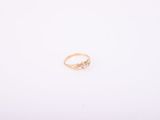 an image of a gold ring with a diamond on it