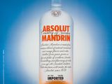 an advertisement for absolut mandrin with an orange slice on top of it