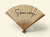 a fan that has writing on it with writing on it