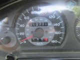 a close up of a speedometer and gauges on a car