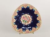 an image of a blue and gold plate with a flower design
