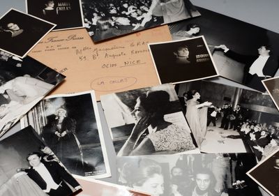 several old black and white photos of people and children on a table