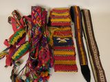 a lot of different colored ties on a white table