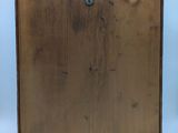 an image of a wooden box with a metal latch on it