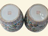 two vases sitting side by side on a table
