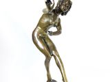 bronze statue of a woman on a marble base with a white background