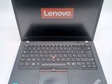 a laptop with a lenovo logo on the screen