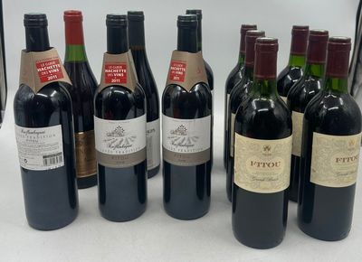 several bottles of wine are lined up in a row on a table