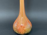 a vase that is sitting on a black table