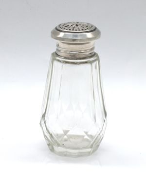 a small glass salt shaker with a silver top