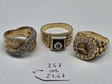 three gold rings with diamonds on them and a price tag