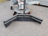 a small machine that is sitting on the side of the road