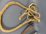 a rope and a pair of scissors on a table