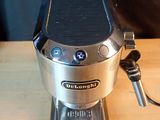 a coffee maker that is sitting on a wooden table