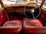 dashboard of a car with red leather seats and a steering wheel