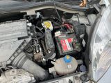 a car engine with its hood open on the street