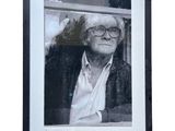framed black and white photograph of an old man with glasses