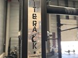 a sign on the side of a metal pole in a gym
