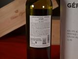 a bottle of wine sitting next to a bottle of wine