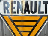 a sign that says renault on it on the side of a building