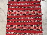 a close up of a piece of red and black fabric