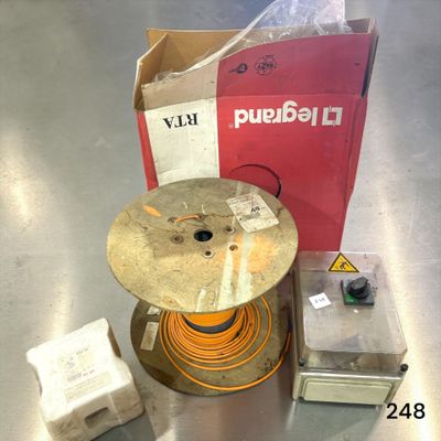 an image of a table with a drum and a box of wires on it