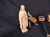 a statue of a woman that is next to a clock