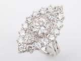 a close up of a diamond ring on a white background