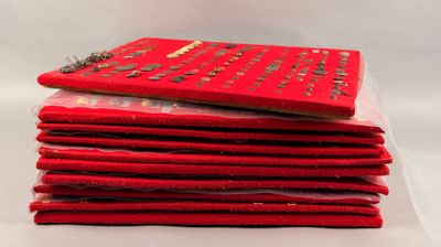 a stack of red books sitting on top of each other