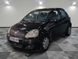 a picture of a small black car parked in a garage