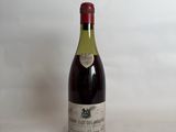 a bottle of wine that is sitting on a table