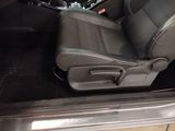 a picture of the inside of a car with the seat up