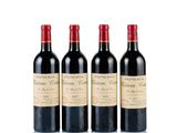 three bottles of red wine sitting next to each other on a white surface