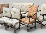 six antique chairs with floral upholstered cushions and wooden legs