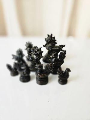 three figurines that are sitting on a table