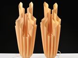 two vases that are made out of paper on a table