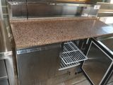 a kitchen with stainless steel appliances and a granite counter top